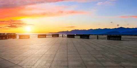 Empty square floor and mountain with sky cloud landscape at sunrise. Stock Photos