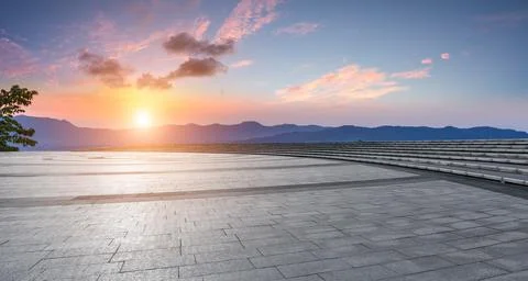 Empty square floor and mountain with sky cloud landscape at sunset. Stock Photos