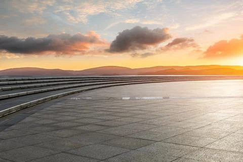 Empty square floor and mountain with sky cloud landscape at sunrise. Stock Photos