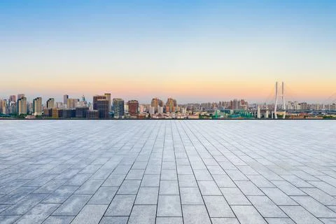 Empty square floor and Shanghai skyline with buildings at dusk,China. Stock Photos