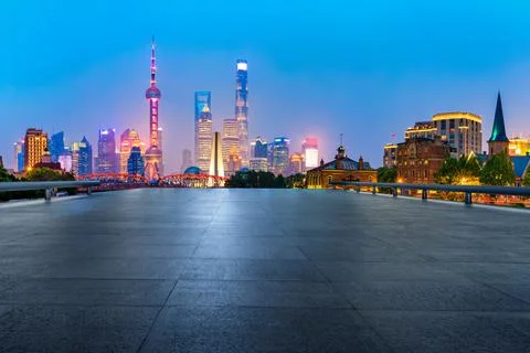 Empty square floor and Shanghai Lujiazui commercial building scenery at night. Stock Photos