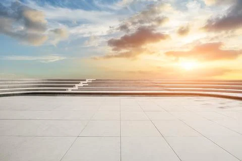 Empty square floor and sky cloud background at sunset. Stock Photos