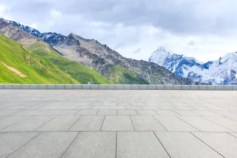 Empty square floor and snow mountain background. Stock Photos