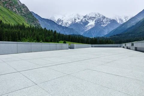 Empty square floor and snow mountain background. Stock Photos