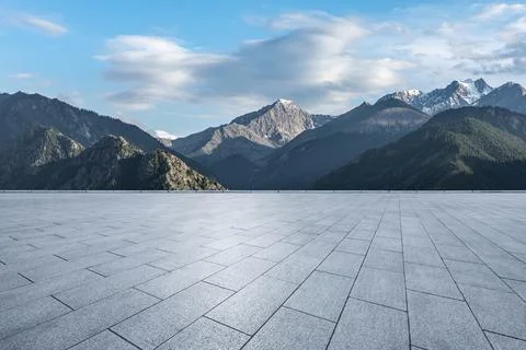Empty square floor and snow mountain background. Stock Photos