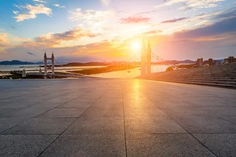 Empty square floors and bridge with river at sunset in Zhoushan, Zhejiang Stock Photos