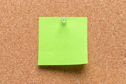 Empty square green pinned sheet on a brown cork reminder Stock Photos