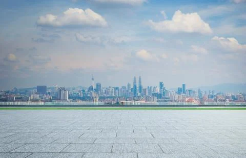 Empty square ground floor with city skyline background . Mixed media . Stock Photos