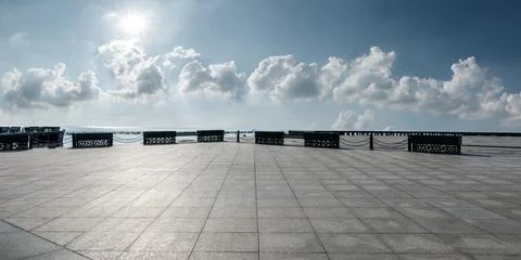 Empty square platform and blue sky with white clouds background. Stock Photos