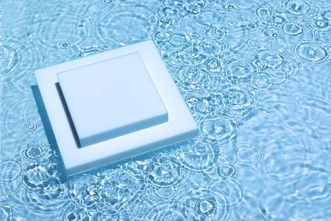 Empty square podium on transparent blue water background Stock Photos