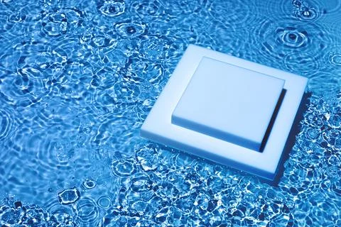 Empty square podium on transparent dark blue water background Stock Photos