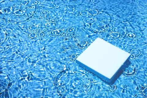 Empty square podium on transparent dark blue water background Stock Photos