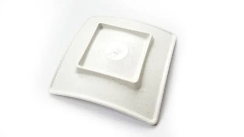 Empty square white plate with ceramic melamin material on back view Stock Photos