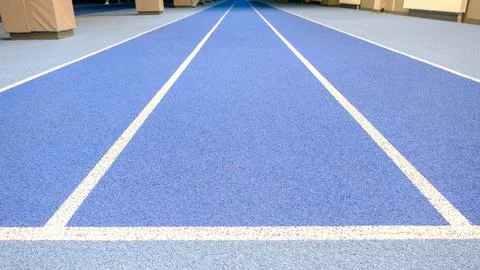 Empty stadium. Colored seats. Row of seats. Treadmill at the stadium. Blue tr Stock Photos
