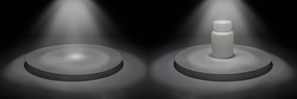 An empty stage with lighting above a circular podium. On a podium is a bottle Stock Photos