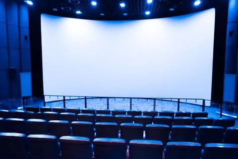 Empty stage in the small movie theater with white screen Stock Photos