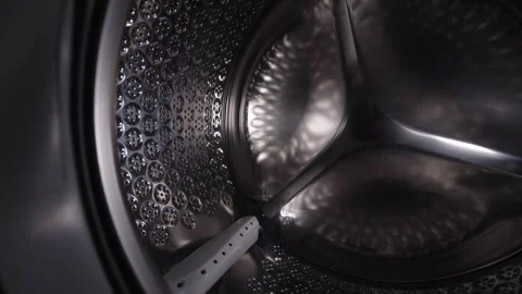 Empty stainless steel washing machine drum inside view close up. Video stock 340276027