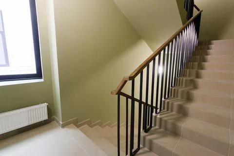 An empty staircase in an office building with no elevator and no people Stock Photos