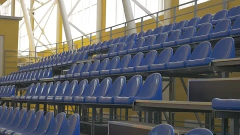 Empty stands, blue chairs, indoor space Stock Footage 285134015