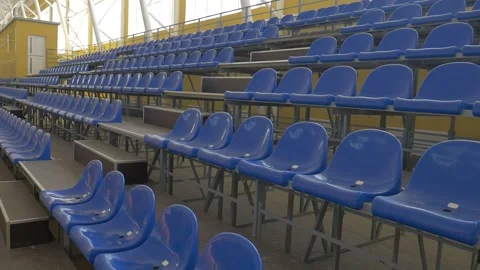 Empty stands, blue chairs, indoor space Stock Footage 285134016