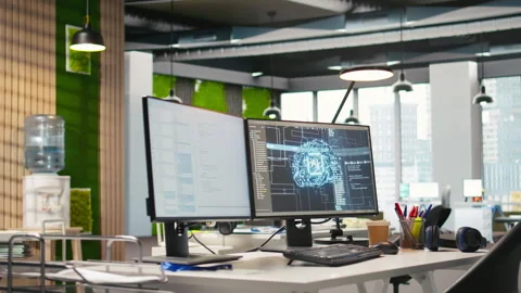 Empty startup office with artificial intelligence program running on PC monitors Stock Footage 313165000