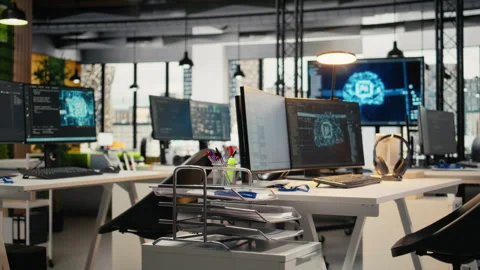 Empty startup office with artificial intelligence program running on PC monitors Stock Footage 322707464