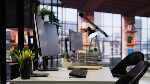 Empty startup office with PC on desk to be used by programmers Stock Photos