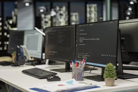 Empty startup office with PC monitors on desk to be used by programmers 스톡 사진