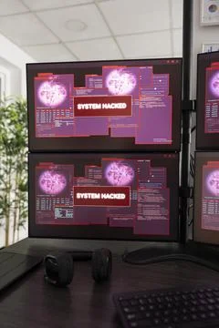 Empty startup office showing hacked system alerts 库存照片