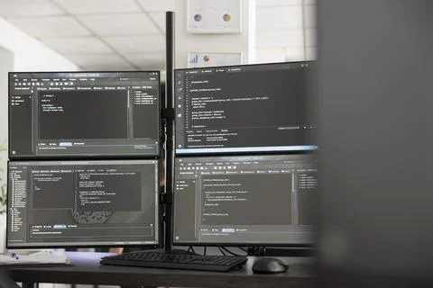 Empty startup workspace with coding on computer screens Stockfoto's