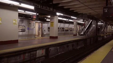 Empty station platform waits a Long Island Railroad train Stock Photos