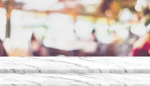 Empty step marble table top food stand with blur cafe restaurant background b Stock Photos