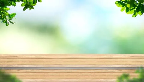Empty step plank wood table top with blur tree in park with bokeh light backg Stock Photos