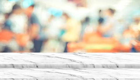 Empty step white marble table top food stand with blur supermarket background Stock Photos