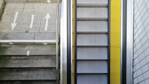 Empty steps of an escalator in a perspective view passing by. 動画素材 208889814