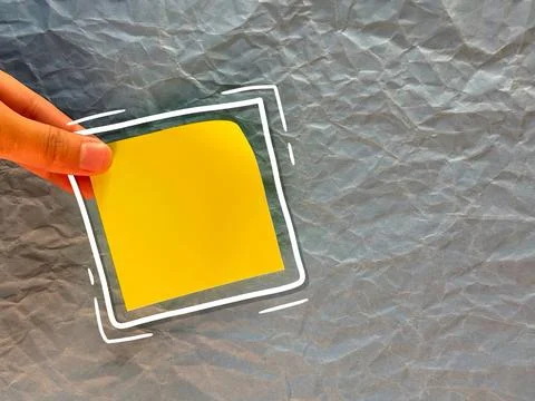 An empty sticker for notes. the hand holds a piece of paper. an empty bubble  Stock Photos