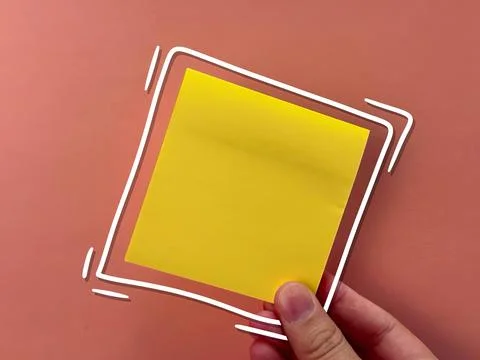 An empty sticker for notes. the hand holds a piece of paper. an empty bubble  Stock Photos