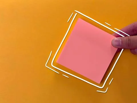 An empty sticker for notes. the hand holds a piece of paper. an empty bubble  Stock Photos
