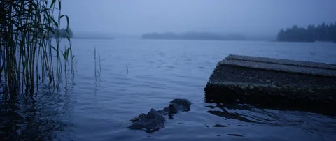Empty stone pier on river during foggy day Stock Footage 85849952