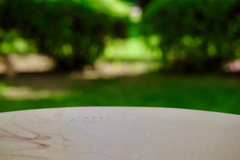 Empty stone table with free space over green background. For product display Stock-Fotos