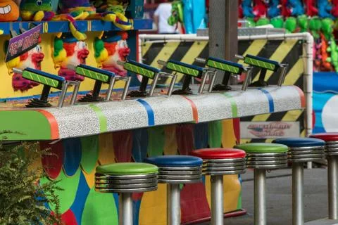 Empty Stools And Squirt Guns At County Fair Game Stock Photos