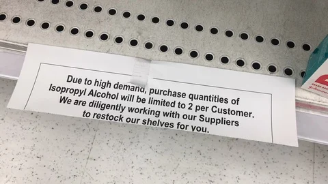 An empty store shelf displays a limit on personal wipes during COVID-19 in Stock Footage 127792451