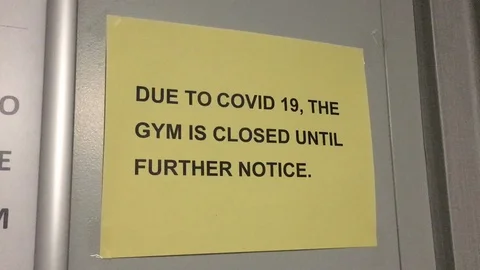 An empty store shelf displays a limit on face masks and gloves during COVID-19 Stock Footage 127851161