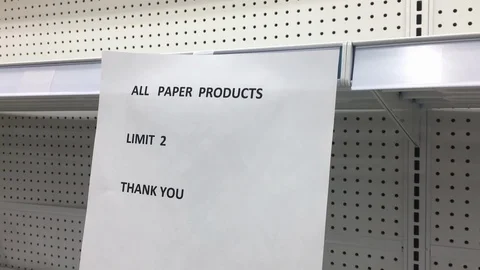 An empty store shelf displays a limit on paper products during COVID-19 in Stock Footage 127851232