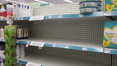 Empty store shelves display a limit on all paper products during COVID-19 in Stock Footage 127851274