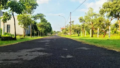 Empty Straight Asphalt Road in Suburb at Sunny Morning after Rain 스톡 동영상 332887076