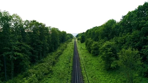 Empty straight single-way railways at summer sunny day. endless railway without Stock Footage 94974876