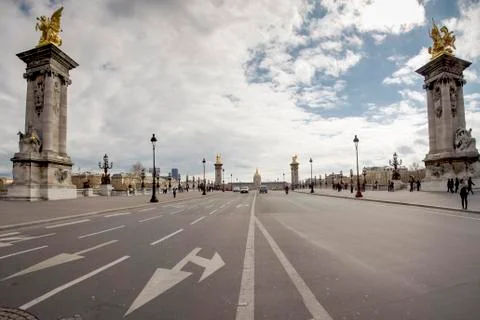 Empty street and Alexandre the third bridge with a view on the Invalides in P Stock Photos