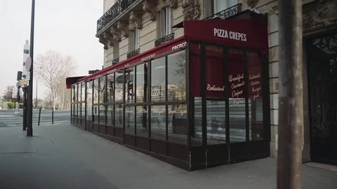 Empty street and closed cafe terrace in Paris during coronavirus lockdown Stock Footage 126753412