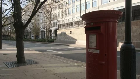 Empty street behind Red royal mail post box Coronavirus lockdown Stock Footage 142912668